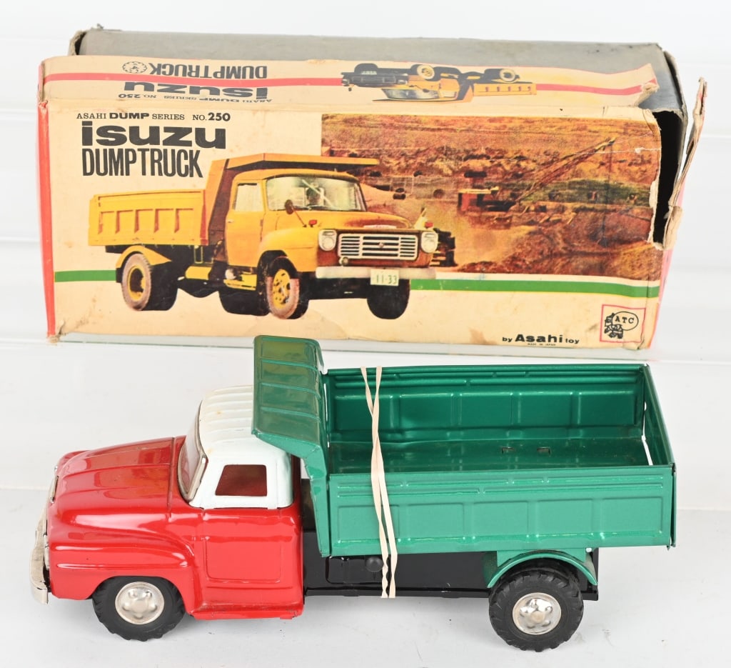 JAPAN TIN FRICTION ISUZU DUMP TRUCK w/ BOX: Nice original condition with working friction motor. Colorful original box has some wear. 9" Excellent