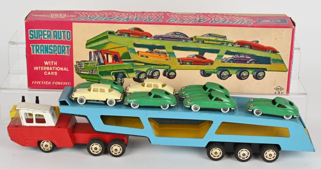JAPAN TIN FRICTION SUPER AUTO TRANSPORT w/ BOX: Japan tin Auto Transport truck with 7 International cars. Friction works. Includes colorful original box. 20" Excellent-Near Mint