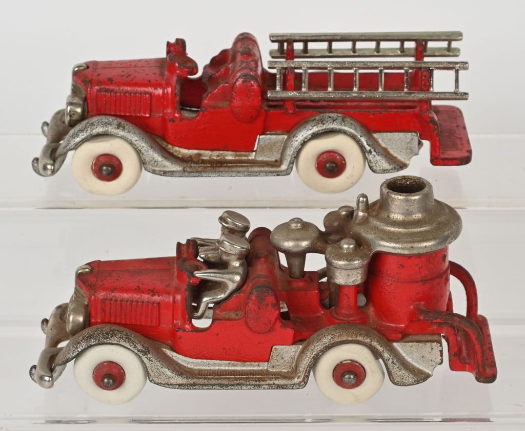 2- HUBLEY CAST IRON NICKEL GRILL FIRE TRUCKS: Both fire trucks have original paint and no cracks or repairs. The ladders are reproduction and the tires have been replaced. 8" Very Good