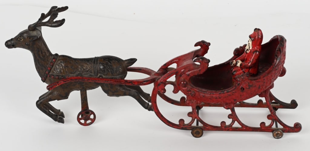 HUBLEY CAST IRON SANTA CLAUS SLEIGH: Hubley cast iron Santa Claus Sleigh. The sleigh looks like an ancient over paint. The reindeer looks original with some red touchup. Santa Claus figure is a replacement. No cracks or repairs. Displays