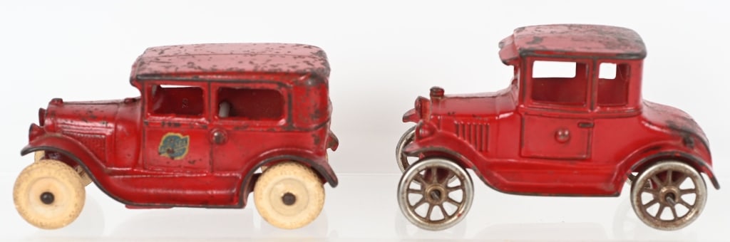 2- CAST IRON FORD MODEL T & MODEL A AUTOS: Lot includes 1. 5" Arcade Model A sedan. complete and original , nice paint and decal. 2. 5" A.C. Williams Model T coupe. All original with nice paint. No cracks or repairs. Excellent