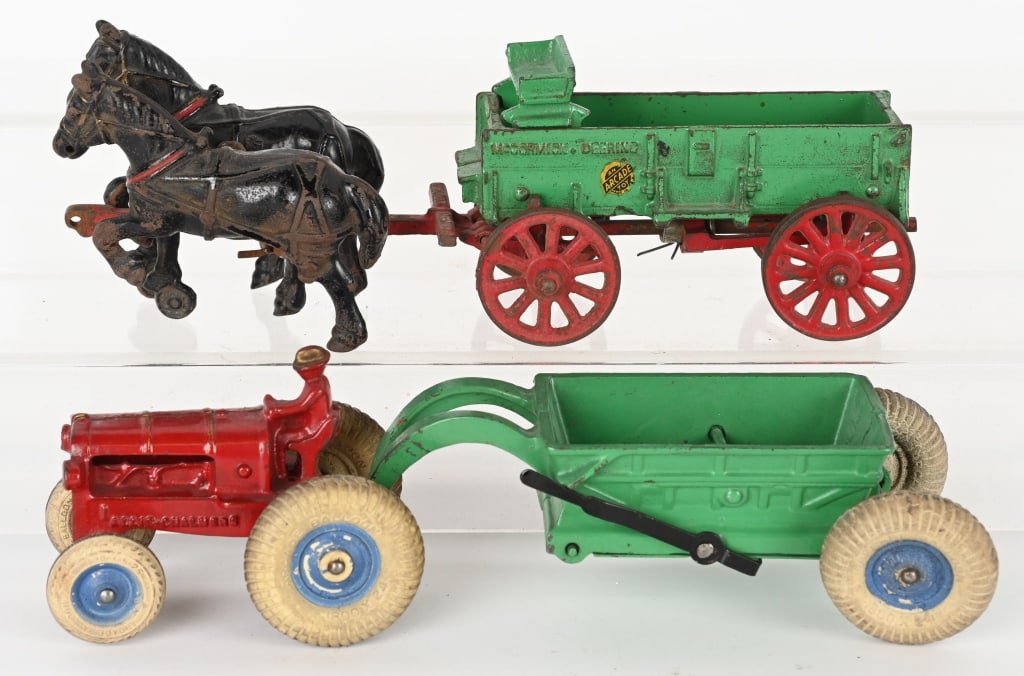 2- ARCADE CAST IRON FARM TOYS: Lot includes: 1. 12" Allis Chalmers tractor pulling dump cart, complete and original. 2. 12" McCormick Deering Horse drawn wagon. No cracks or repairs. Very Good-Excellent