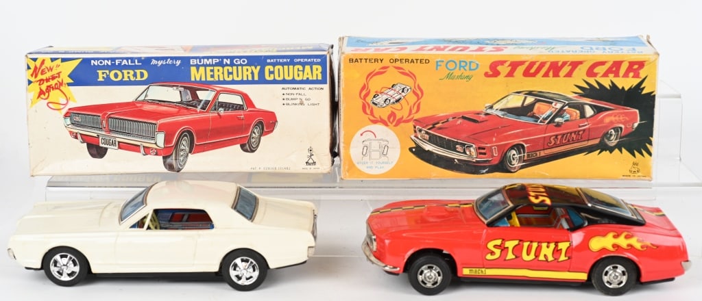 2- JAPAN FORD MUSTANG & MERCURY COUGAR w/ BOXES: Nice pair of tin battery op toy autos with the original boxes. 1. 10" Mercury Cougar, motor works, drive wheel did not turn . 2. Ford Stunt Mustang, worked when tested. Both Excellent