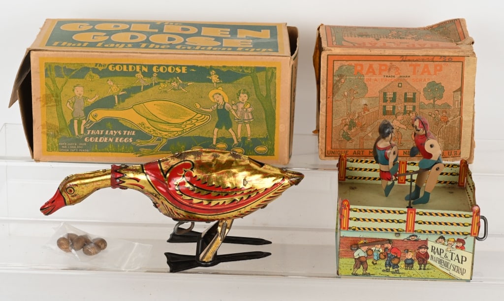 2- TIN WINDUP TOYS, MARX & UNIQUE ART w/ BOXES: Lot includes 1: Unique Art windup Rap & Tap. Excellent working, missing one leg, original box is incomplete. 2. 9" Marx windup Golden Goose with 6 wood eggs. Working, original box is missing end flap.