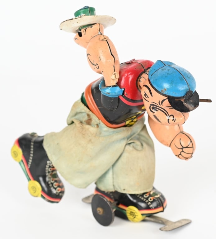LINEMAR TIN WINDUP POPEYE ROLLER SKATER: All original with nice colors. Works. Missing wood pipe bowl. 5 1/2" Excellent