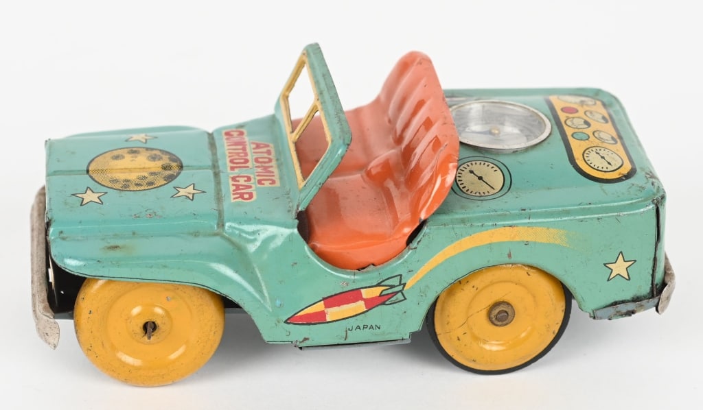 JAPAN TIN FRICTION ATOMIC CONTROL CAR: Space Jeep with Compass in back. All original with nice graphics. Friction works. 5" Excellent
