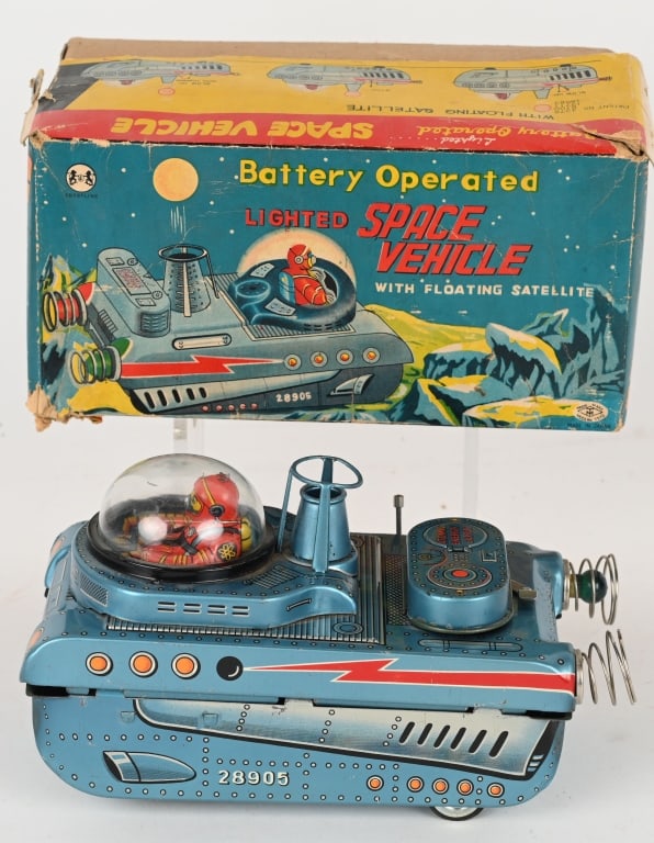 JAPAN BATTERY OP SPACE VEHICLE w/ BOX: All original in nice condition. The vehicle is loose at the seam. Did not work when tested. Does not come with ball. Needs a little work to be a very nice toy. Boxed 9" Very Good