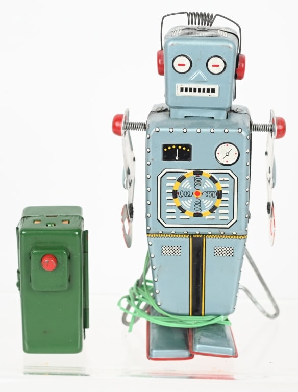 YONE BATTERY OP EASEL BACK ROBOT: Yonezawa battery operated Easel Back Robot. All original and complete with correct battery box remote control. Very clean condition. Battery Box is loose from wire. 6" Excellent