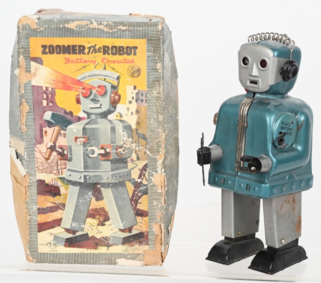 JAPAN TN BATTERY OP ZOOMER ROBOT w/ BOX: Japan TN Battery operated Zoomer Robot. All original and complete. Did not work when tested. One leg has corrosion. Colorful original box is worn. 8" Very Good