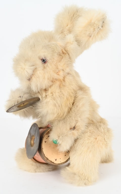 DECAMPS CLOCKWORK RABBIT DRUMMER AUTOMATON: Made in France. All original with rabbit fur. Has glass eyes. Has original drum and cymbals. Very large piece. Windup works and rabbit drums and hops. A rare and wonderful piece. 12" Excellent