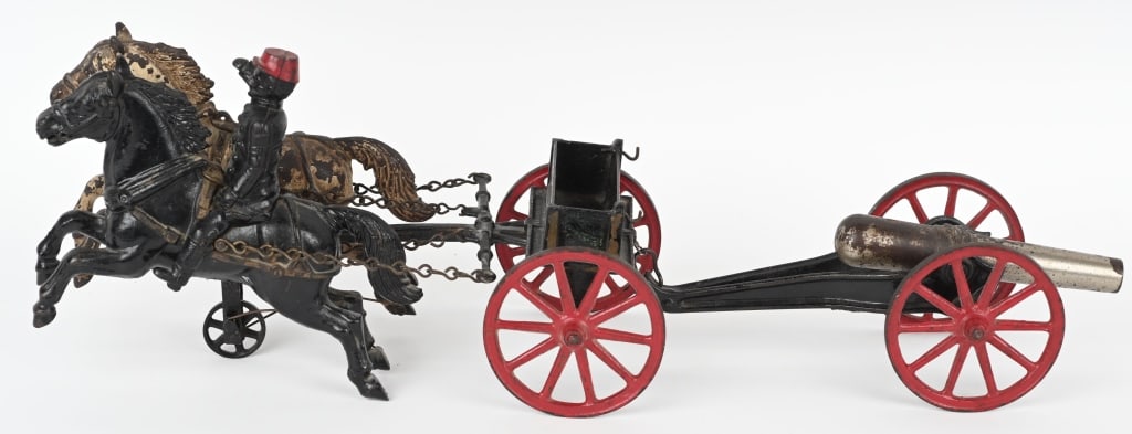 IVES CAST IRON OVERSIZED FLYING ARTILLERY: Extremely rare oversized cast iron Ives Flying Artillery. The toy features 2- 10" horses with a 6 3/4" full bodied rider. The wheels are 4 1/2" diameter. The cannon is 12" long with a 7 1/2" barrel. T