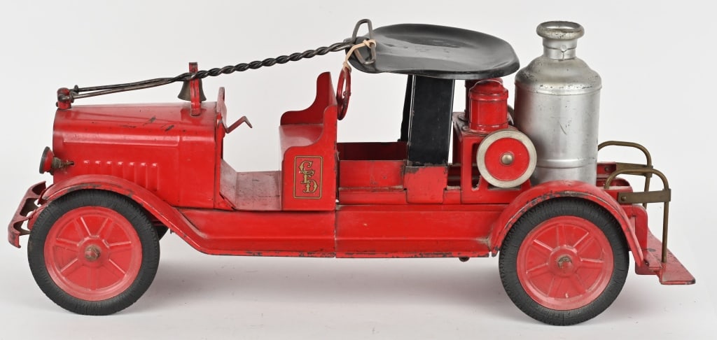 BUDDY L RIDE-ON PUMPER FIRE TRUCK: 1933-34 All original pressed steel truck. Has rubber tires, head lights, and bumper. Has very nice original paint and decals. Still has seat and pull handle. Steering wheel loose but present. A great