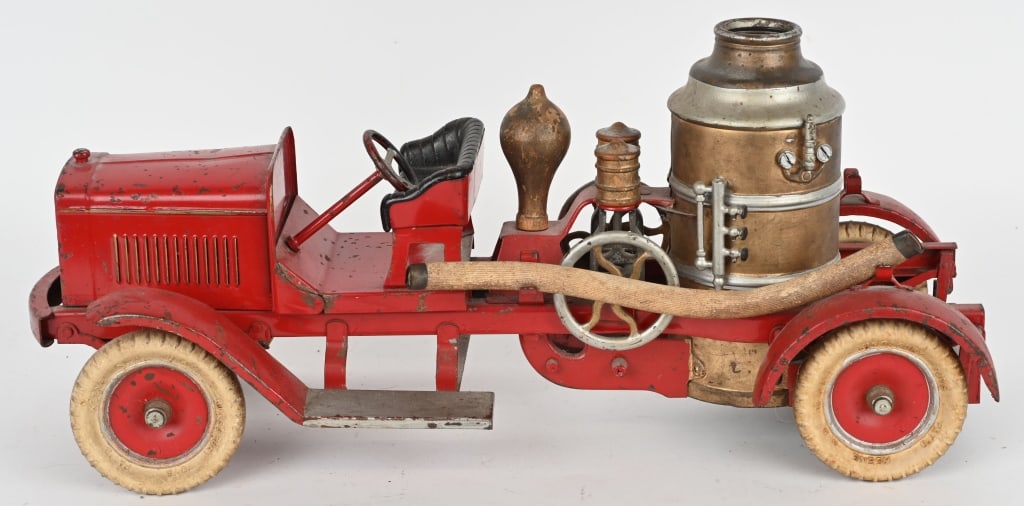 KINGSBURY PRESSED STEEL FIRE PUMPER TRUCK: Original Kingsbury Fire Pumper truck. Complete except for one hose and pull handle. Windup pistons do not work. The hood and floor are loose, and it is missing part of the steering linkage. 22" Very G
