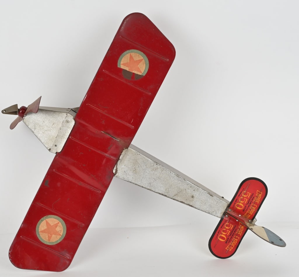 EMPIRE EXPRESS No. 550 TIN MONOPLANE: The plane looks to be all original. The wings have some bending, and should clean to a higher grade. 18" wingspan. Very Good