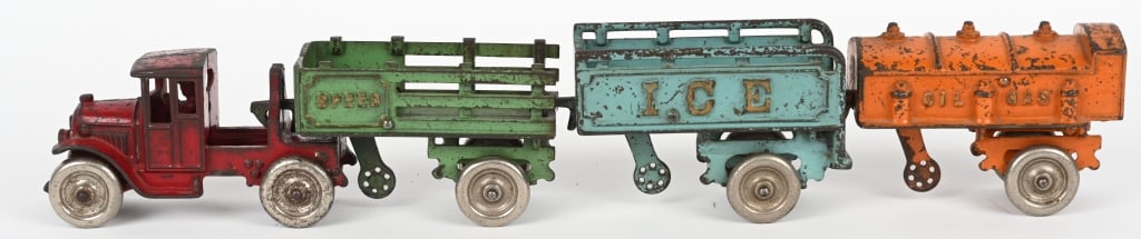 KENTON CAST IRON SEMI & 3 TRAILER SET: Includes Semi Truck with Speed Trailer, Oil & Gas Trailer, and Ice Trailer. All original with no breaks or repairs. Set has decent paint throughout and displays well. A very hard set to find all compl