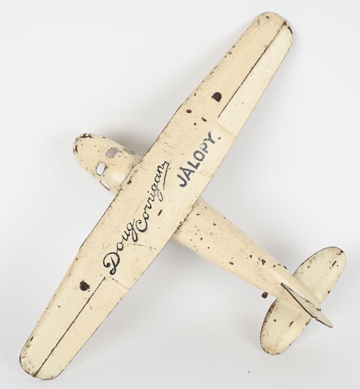 WYANDOTTE PRESSED STEEL DOUG CORRIGAN AIRPLANE: Original Wyandotte 1930's Doug Corrigan Jalopy airplane. This is the large version with a 13" wingspan. Pilot Doug Corrigan was nicknamed "Wrong Way " Corrigan in 1938 when he attempted a transcontine