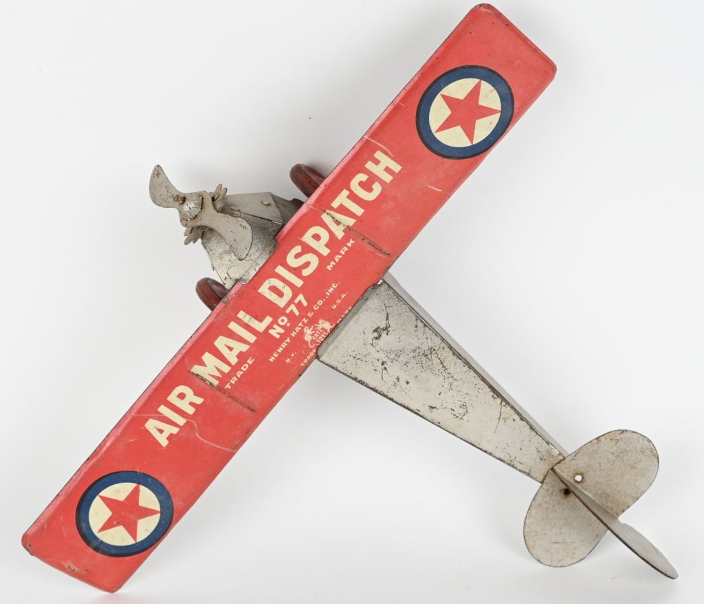 KATZ TIN WINDUP AIR MAIL DISPATCH AIRPLANE: Scarce early airplane, made by the Henry Katz toy company. Windup worked when tested. 11 1/2" Wingspan. Very Good-Excellent
