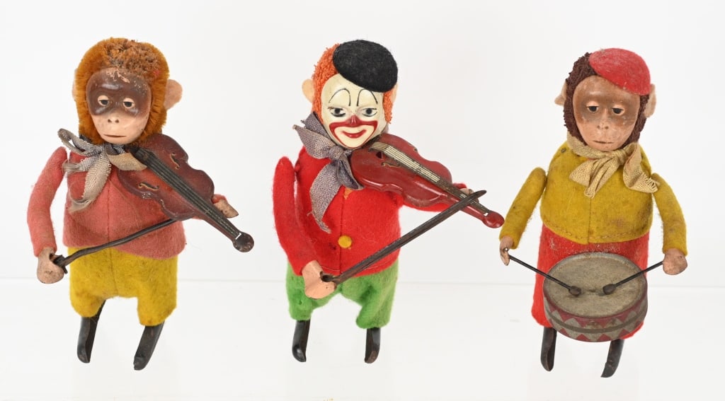 3- GERMAN SCHUCO TIN WINDUP CLOWN & MONKEYS: Lot of 2 windup Schuco monkeys and a clown. Windups worked when tested. One monkey was missing a hat. One key is included. 4" Very Good-Excellent