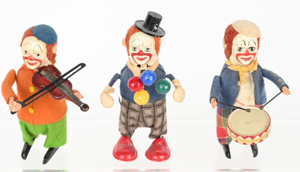 3- GERMAN SCHUCO TIN WINDUP CLOWNS: Lot of 3 Schuco tin windup clowns. The violinist and juggler work, the drummer does not. 4" One key is included. Very Good-Excellent