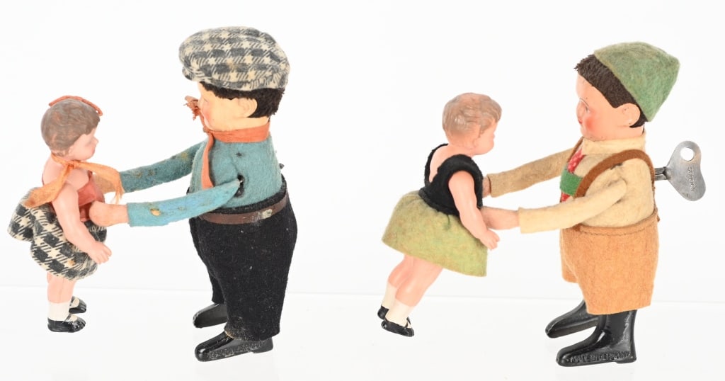 2- GERMAN SCHUCO TIN WINDUP DANCING BOYS & GIRLS: Lot of 2 Schuco tin windup dancing boys and girls. Both worked when tested. One key is included. 5" Excellent