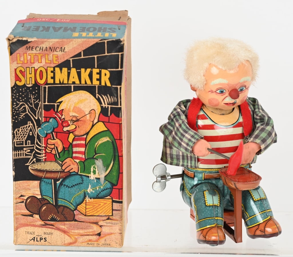 JAPAN TIN WINDUP LITTLE SHOEMAKER w/ BOX: Very nice mostly tin windup toy that worked when tested. Includes colorful original box. 6 1/2" Excellent