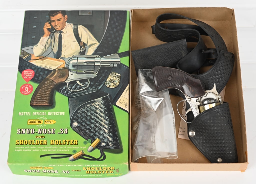 MATTEL SNUB NOSE .38 CAP GUN SET w/ BOX: Nice set includes cap gun, badge, Id, holster and bullets. Cap gun has been use and hangs up sometimes. Could use some cleaning. Box is 13" by 8". Very Good-Excellent
