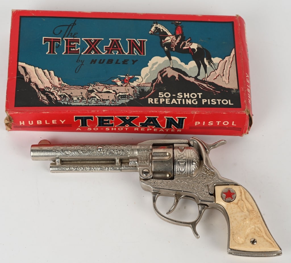 HUBLEY CAST IRON TEXAN CAP GUN w/ BOX: All original Hubley nickel plated cast iron cap gun. Unfired, includes original box. 8 1/2" Excellent