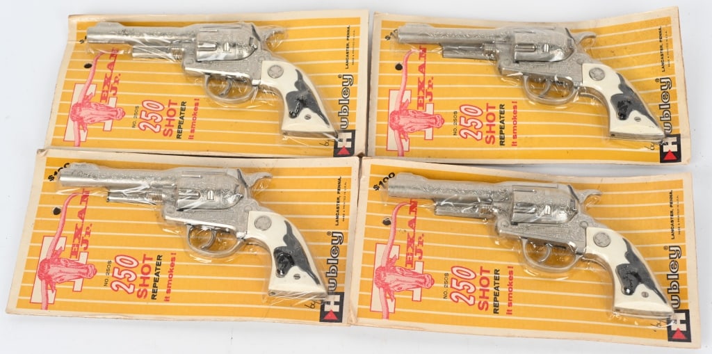 4- HUBLEY TEXAN JR. 250 SHOT CAP GUNS, SEALED: 4- Texan Jr. cap guns sealed on the original cards. Old store stock. 10", Excellent-Near Mint