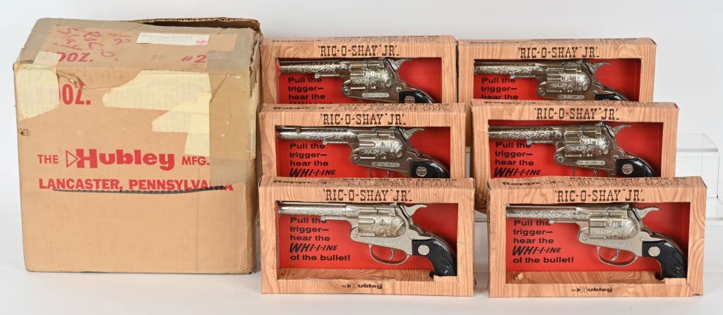 6- HUBLEY RIC-O-SHAY JR CAP GUNS, w/ BOXES: Lot of Old Store Stock Hubley Ric-O-Shay Jr cap guns unused in original boxes. Includes Hubley shipping box. 8" Excellent-Near Mint