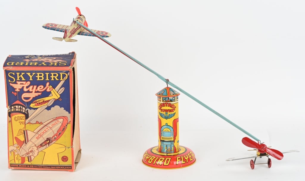 MARX TIN WINDUP SKYBIRD FLYERS w/ BOX: The toy is complete and original and worked when tested. The colors are bright and the toy has gloss. The original graphic box has wear. Toy is 9" Folding rod is 25". Wing Span is 8". Excellent