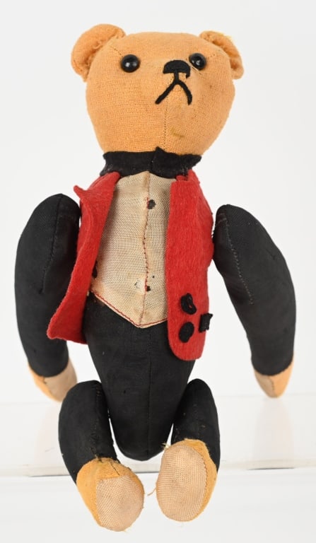 ANTIQUE MECHANICAL TUMBLING TEDDY BEAR: Nice looking Teddy Bear dressed in a suit. He has gyro type mech that is operated by rotating the arms. Worked when tested. He has button eyes and a sewn on nose and mouth. 10" Very Good-Excellent