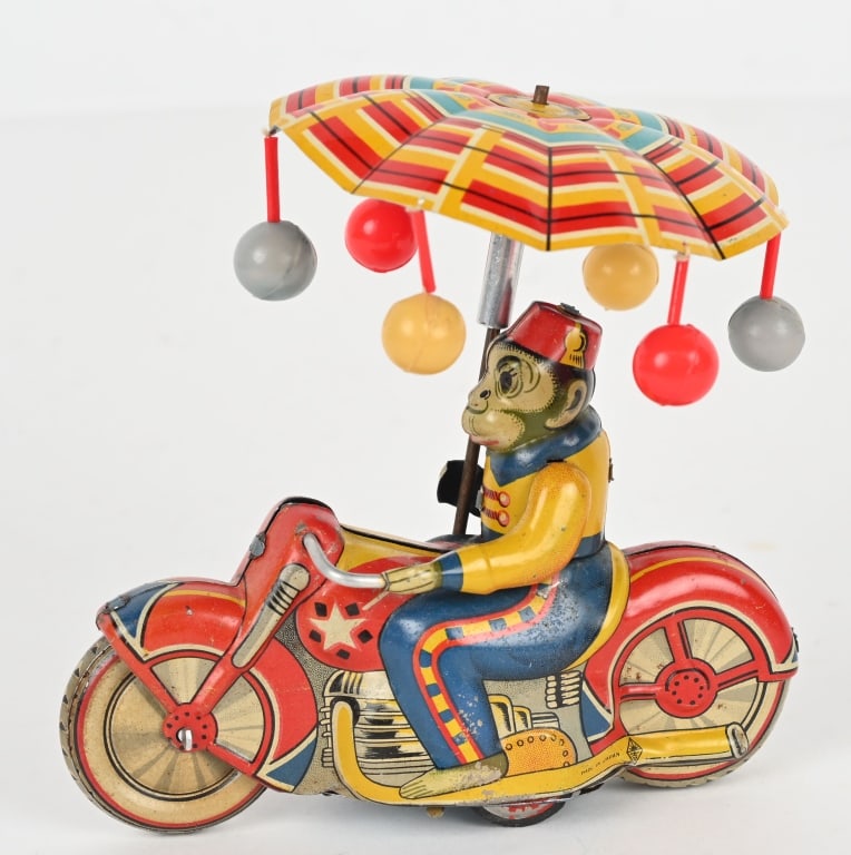 JAPAN TIN FRICTION MONKEY ON MOTORCYCLE: All original with nice colors. Friction not working. Comes with umbrella. 5 1/2" Excellent