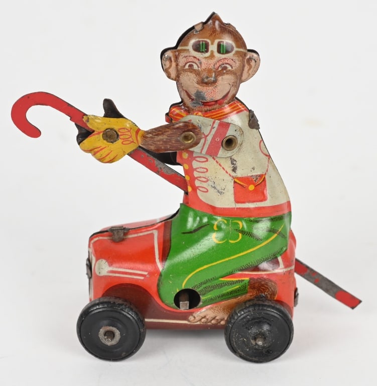 JAPAN TIN WINDUP MONKEY IN CAR: All original and works. 3 1/2" Excellent