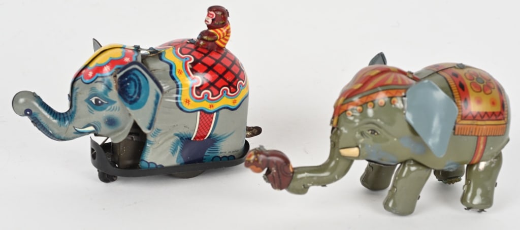 2- JAPAN TIN WINDUP MONKEY ON ELEPHANTS: Both all original in great condition. Windup works. 5 1/2" Excellent