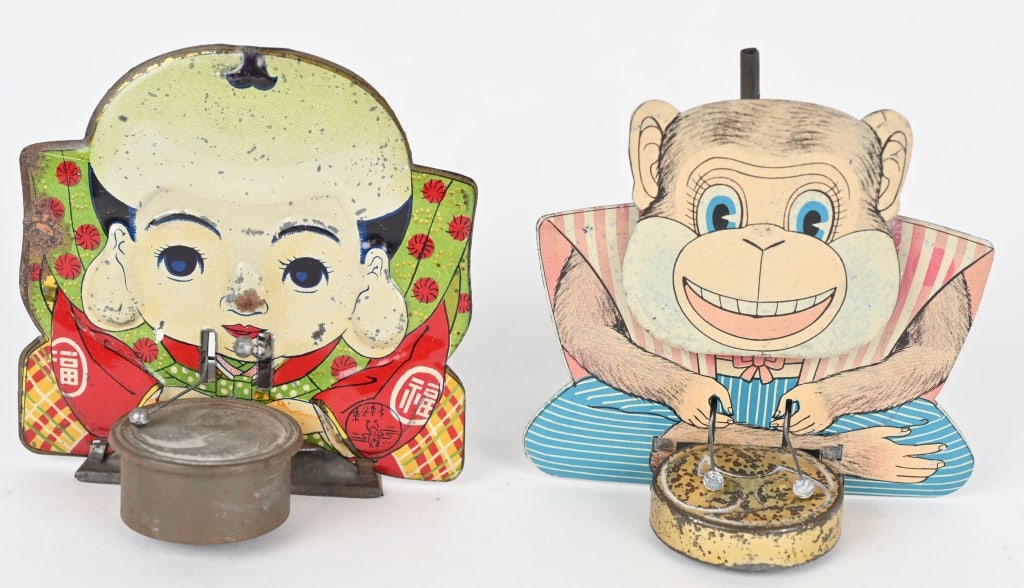 2- PREWAR JAPAN TIN DRUMMERS: Includes Monkey and Man Drummers. Both in nice condition. Man has some issues with action. Both candle powered. 4" Very Good-Excellent