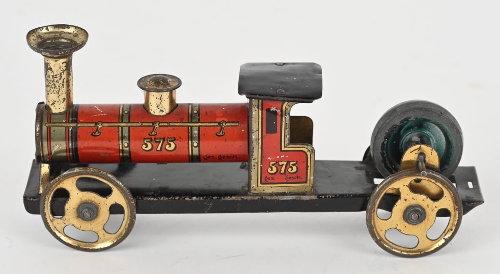 GERMAN TIN FLYWHEEL TRAIN LOCOMOTIVE: All original in nice shape. 6" Excellent