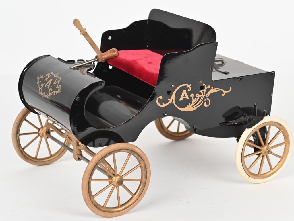 ACME 1903 TIN WINDUP CURVED DASH OLDSMOBILE: Original Acme curved dash Oldsmobile that has been restored. Three white rubber tires are original and one is a replacement. Windup worked when tested. 12" Excellent