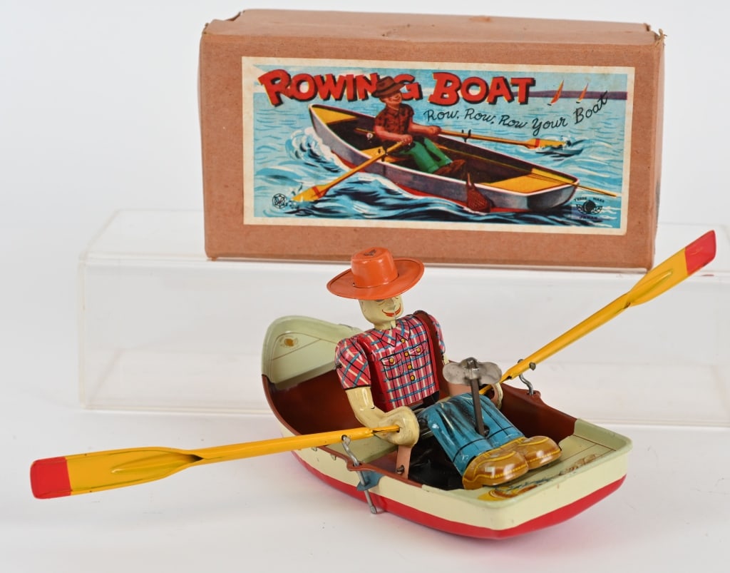 JAPAN TIN WINDUP ROWING BOAT: The toy is complete and original, and looks unused. Windup works well. Nice original box. 8" Excellent