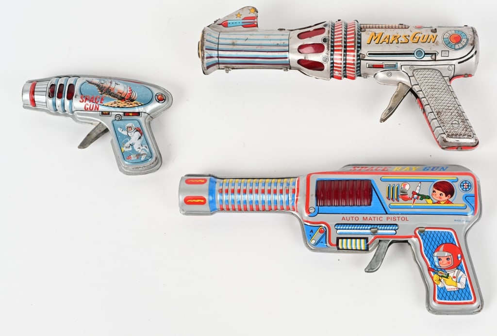3- VINTAGE TIN SPACE GUNS: All original with nice colors and graphics. Largest 9 1/2" AS-IS