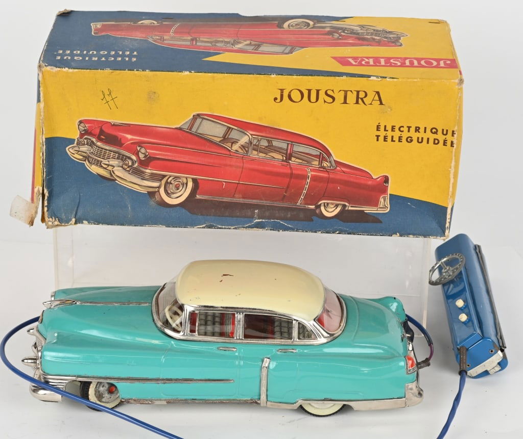JOUSTRA BATTERY OP 1953 CADILLAC w/ BOX: Joustra battery operated 1953 Cadillac. All original in great condition. Has steering remote control. Boxed 13" Excellent