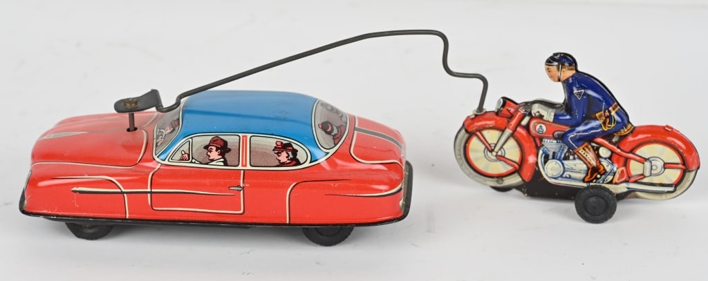 GERMAN TIN WINDUP MOTORCYCLE CHASING CAR (1 of 4)