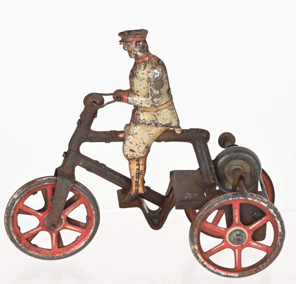 GERMAN ISSMAYER TIN FLYWHEEL MAN ON TRICYCLE (1 of 4)