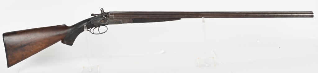 JOHN P. LOVELL & SONS LONDON ENGLAND 12 GA SXS: SERIAL NUMBER: 262. BARREL: 30". CALIBER: 12 GA. MANUFACTURED: 1852-1892. Metal is coin finished with Damascus nine twist steel barrels. Bead front sight , with double hammers and triggers. Light Engr