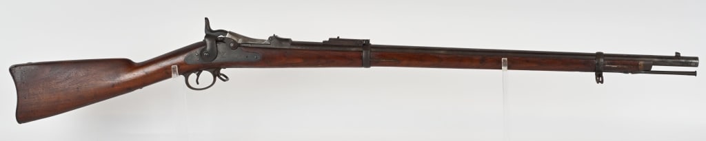 US MODEL 1884 TRAPDOOR SPRINGFIELD CADET RIFLE: SERIAL NUMBER:567213. BARREL 29 5/8". CALIBER 45-70. It features two barrel bands, nose cap, cleaning rod, and Buffington rear sight. Lock is marked "US SPRINGFIELD" with Eagle in center. Breech block