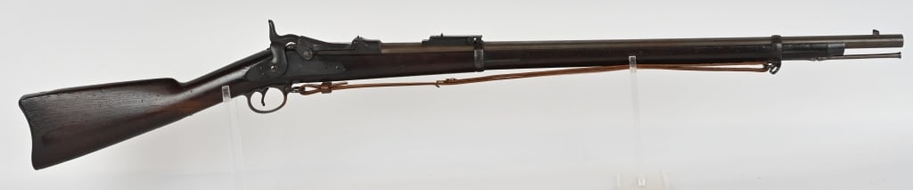 US MODEL 1884 TRAPDOOR SPRINGFIELD CADET RIFLE: SERIAL NUMBER:554802. BARREL 29 5/8". CALIBER 45-70. It features two barrel bands, nose cap, cleaning rod, and Buffington rear sight. Lock is marked "US SPRINGFIELD" with eagle in center. Breech block