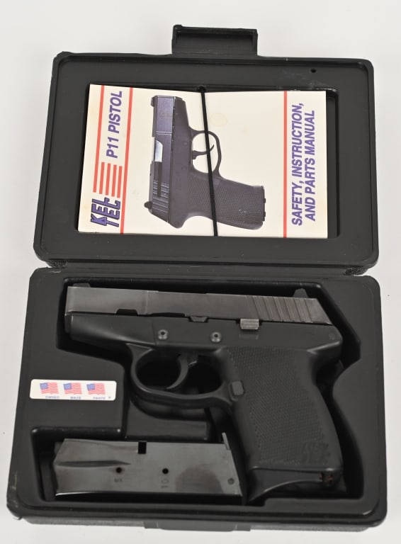 KEL-TEC P-11 WITH FACTORY BOX AND EXTRA MAGAZINE: SERIAL NUMBER: 05524. BARREL: 3".CALIBER: 9MM. Metal is blued steel with stainless steel barrel and 3-dot sights. Frame is black polymer with belt clip, and comes with 2- magazines, Factory box. CONDI