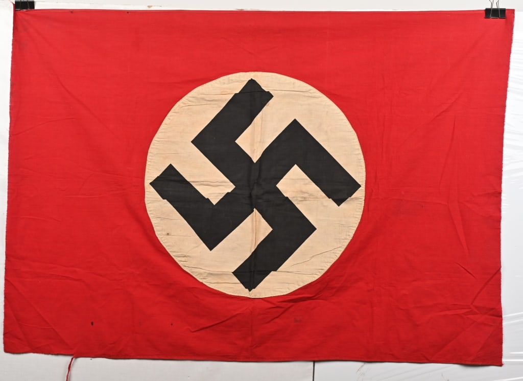 WWII NAZI GERMAN NSDAP SMALL FLAG / BANNER WW2: Roughly 35 x 49 inches, double sided cotton construction pennant. The pennant features a red base field with a separate central white circular disk with a printed canted black swastika to its center.