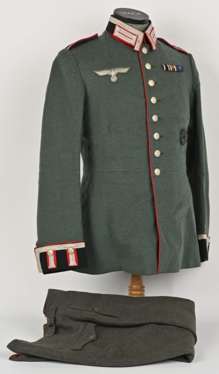 WWII NAZI GERMAN ARTILLERY UNIFORM WAFFENROCK WW2: Issued and unit marked field-gray wool construction M35 dress tunic features a vertical eight button front closure with single metal hook and eye positioned at the forward neckline and a lay dow
