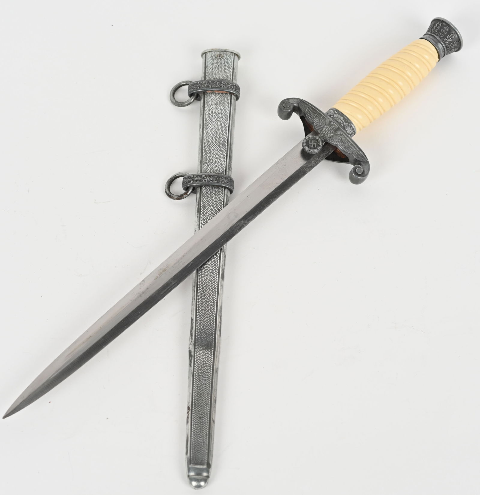 WWII NAZI GERMAN ARMY OFFICER DAGGER BY TIGER WW2: The dagger features a roughly, 26cm long drop forged steel construction nickel/silver plated stiletto style blade with a flat central ridge. Blade shows typical scabbard runner marks. Reverse ricasso