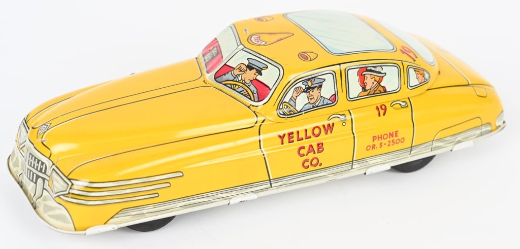 MARX TIN WINDUP YELLOW TAXI CAB: Complete and original Marx tin windup Yellow Cab. Windup works. Bright colors with gloss. 11" Excellent